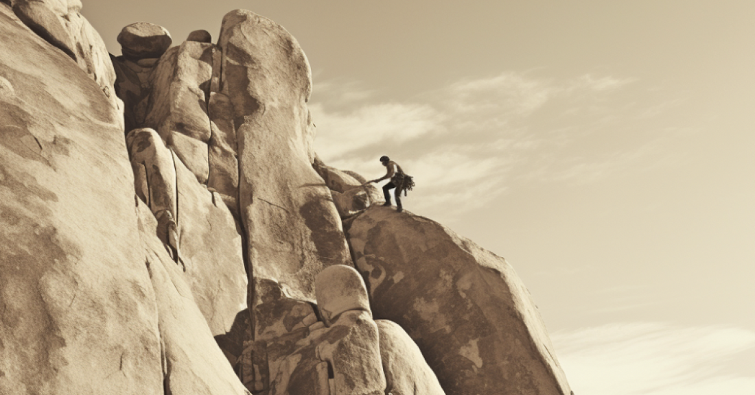 A man climbing a mountain