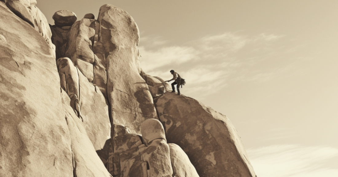 
  A man climbing a mountain
