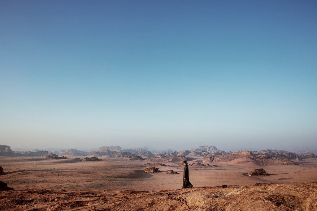 Woman walking in the desert