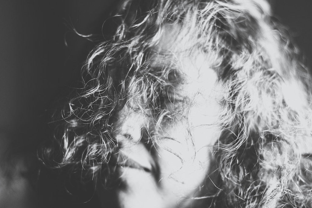 Woman with hair in front of her face