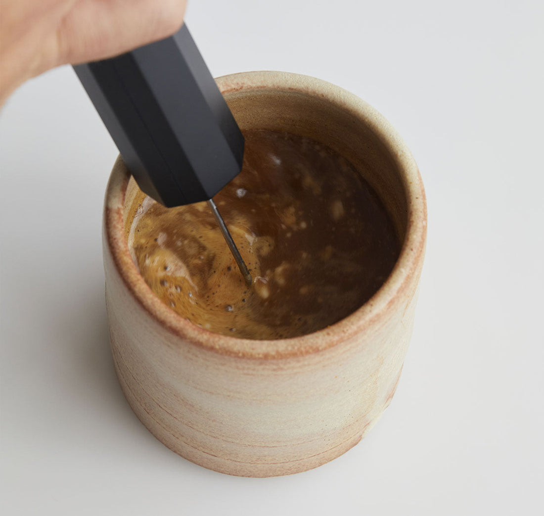 Frother mixing a cup of MUD