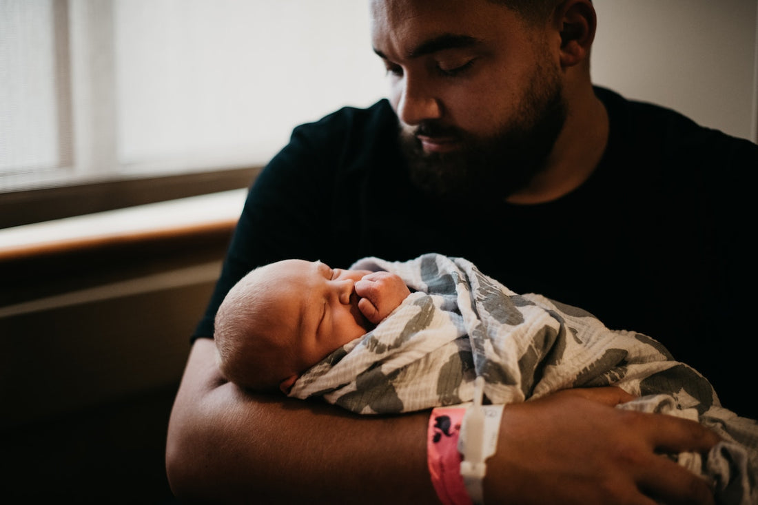 
  Father holding a baby
